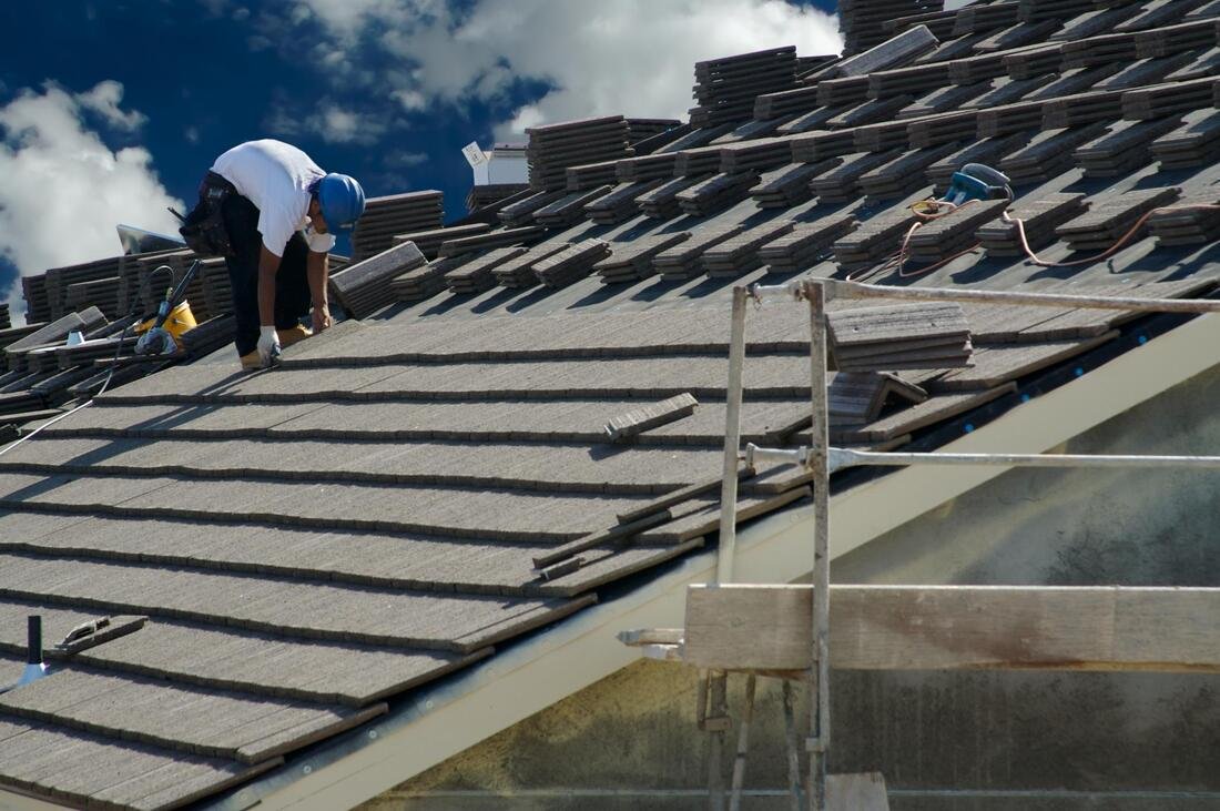 Roofing crew working on a Grand Rapids residential roof